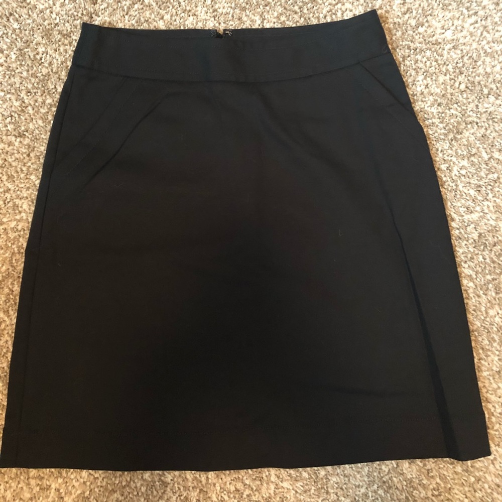 Knee length black skirt